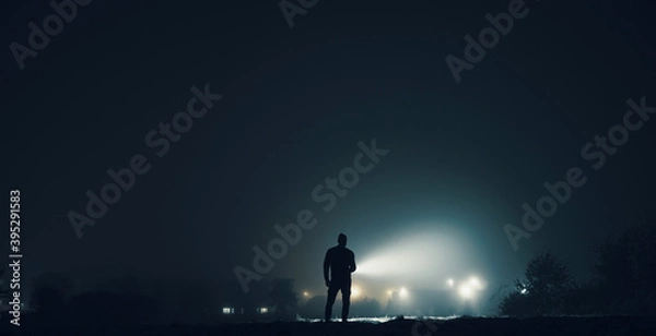 Obraz Lighting at night with a powerful flashlight