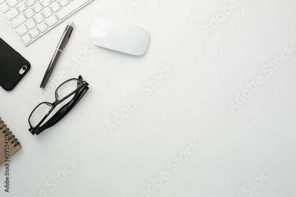 Fototapeta Office workplace with keyboard, notepad, glasses telephone and pen