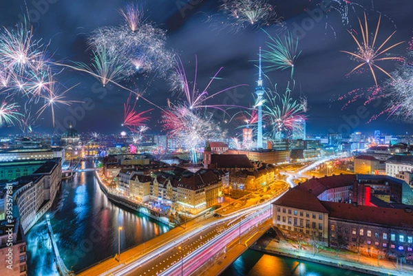 Fototapeta Display of Fireworks over Berlin Alexanderplatz on New Year's Eve