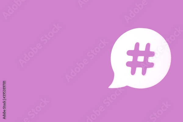 Obraz Purple background with hashtag in bubble speech.