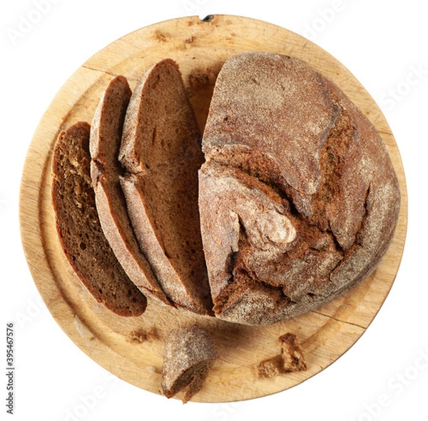 Fototapeta Freshly baked sliced brown bread on cutting board isolated on white background. Flat lay.