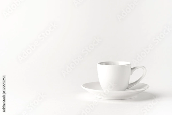 Obraz White coffee cup and a saucer on a white background.