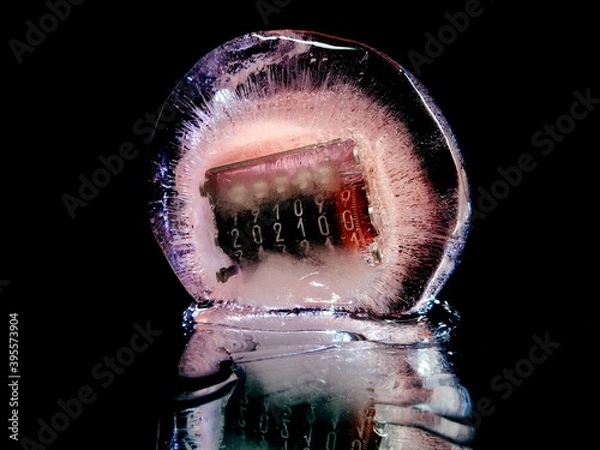Obraz abstract macro photo with a counter frozen in ice that shows the 2021 new year