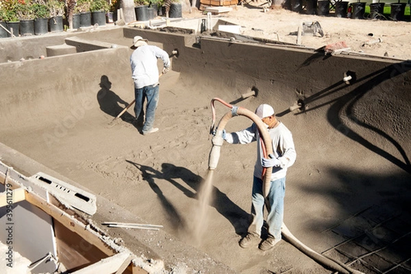 Fototapeta Spraying gunite on a new pool form