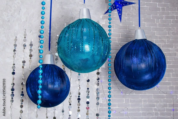 Obraz Composition from three blue christmas balls hanging on ribbon,