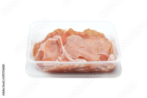 Fototapeta fresh Sliced raw pork in plastic box on white clear background.