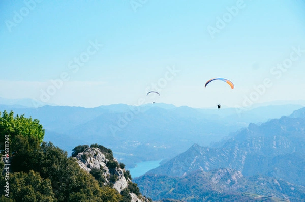 Obraz Parachuting flying over mountains