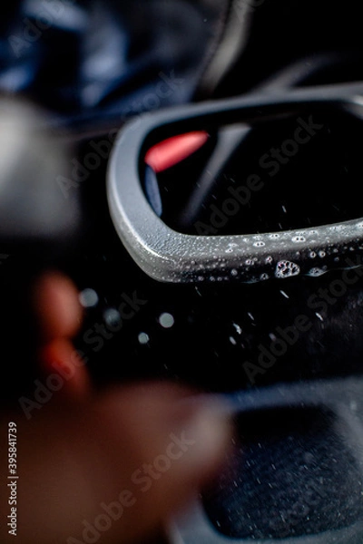 Obraz spraying a soapy cleaning product 