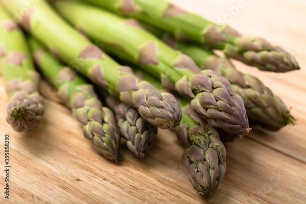 Fototapeta Asparagus on Wooden Background