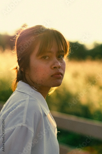 Fototapeta portrait of a child in a field