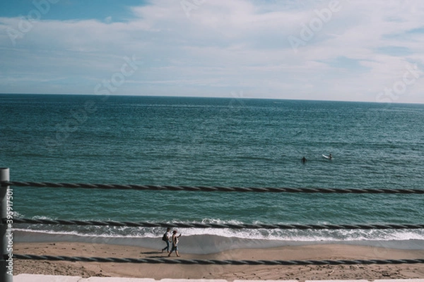 Obraz 海岸にいるサーファー