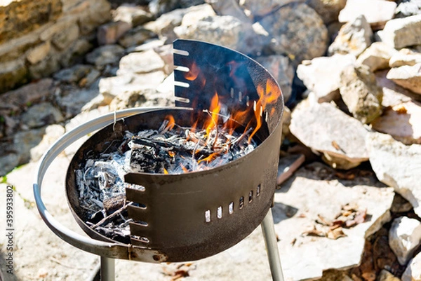 Obraz .brazier with burning branches. fire for rostil