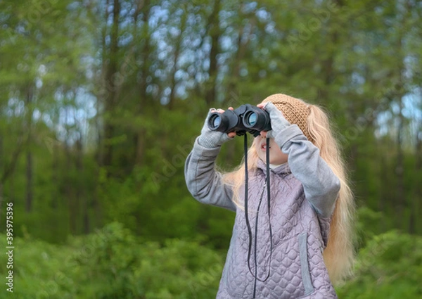 Fototapeta Girl looking through binoculars