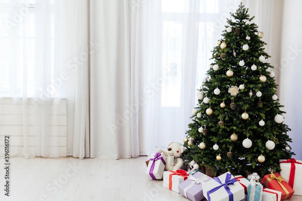 Fototapeta Christmas tree pine with gift decoration decor balls garlands new year interior
