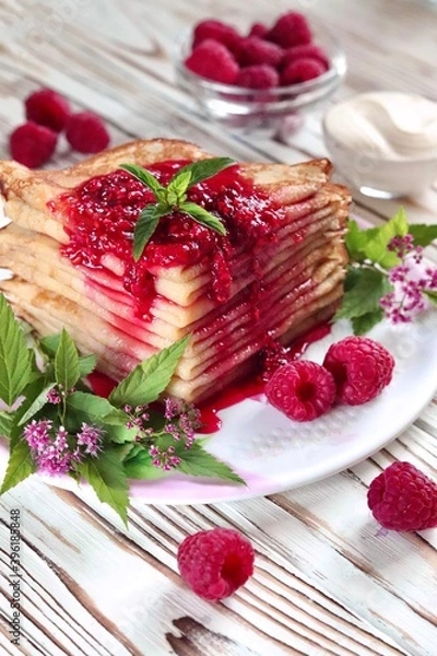 Obraz Pancake poured with raspberry jam on a platter