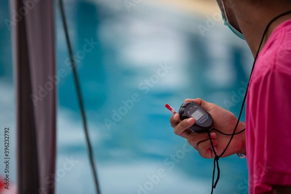 Obraz Hand holding the device Race timer