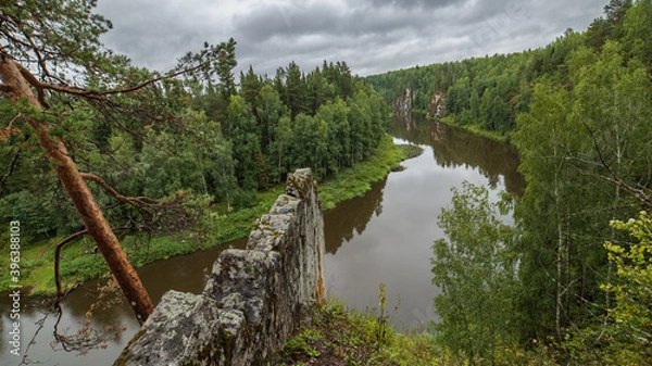 Fototapeta landscape with river, forest and rock on the side