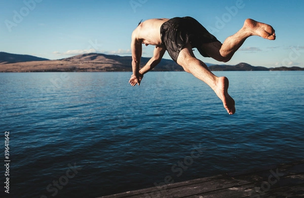 Obraz person diving into a lake