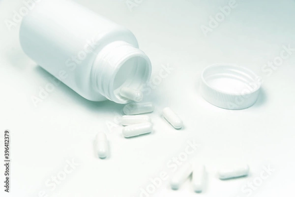 Fototapeta close up. medical capsules on a white background.