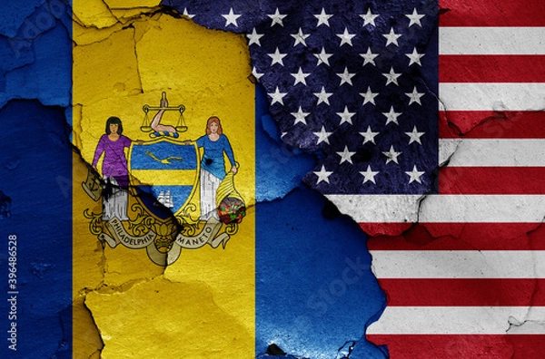 Obraz flags of Philadelphia and USA painted on cracked wall