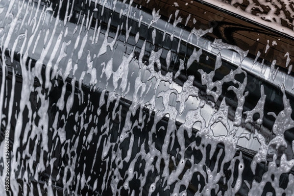 Obraz White soap stains on a black background.