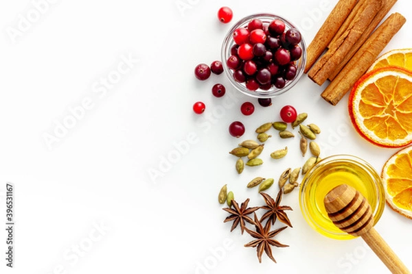 Obraz Various spices for preparing mulled wine hot drink. Cinnamon, honey, spices and cranberries