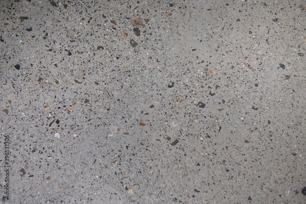 Fototapeta Ground Concrete floor inside building with polished gravels.
