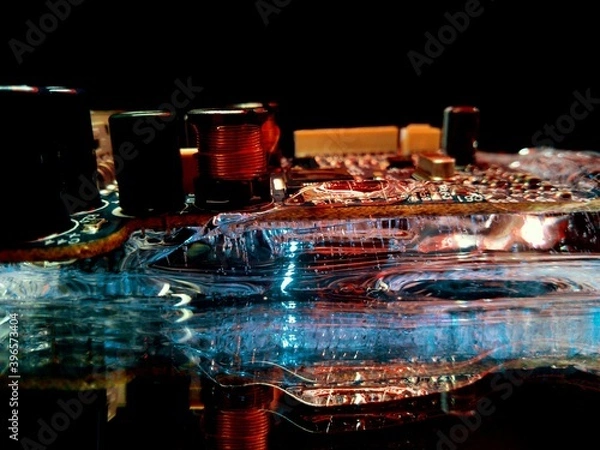 Fototapeta ice and electrical circuit illuminated in the dark like city lights in creative and abstract photography