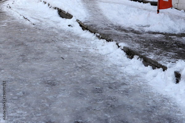 Obraz Uncleaned from snow, icy sidewalk.