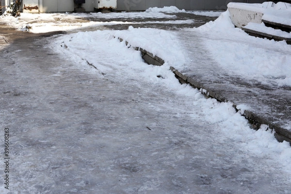 Obraz Uncleaned from snow, icy sidewalk.