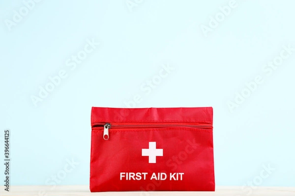 Obraz First aid kit on mint background