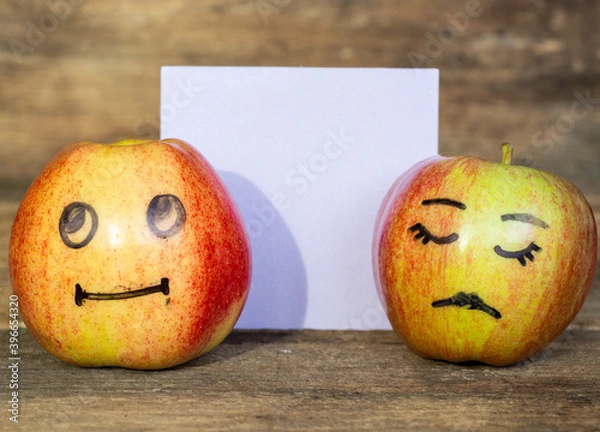 Fototapeta abstract image of couple hide your human emotions from others. different emotions from happy smile joy to sadness and anger Face on an apples