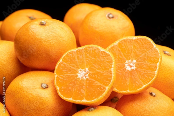 Fototapeta 山盛りのみかん カットしたみかんの断面