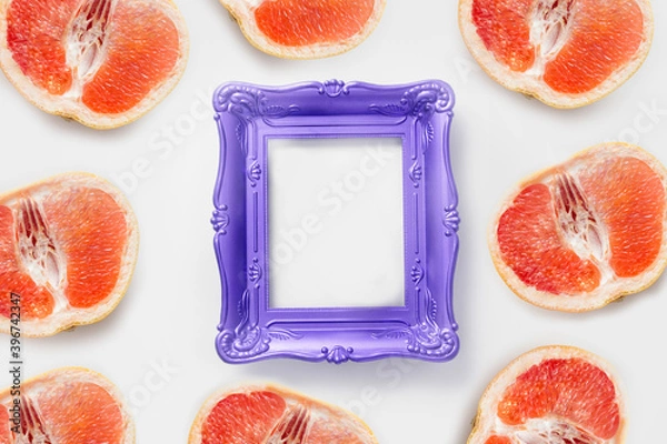 Fototapeta Photo frame with copy space decorated grapefruit. Mockup concept