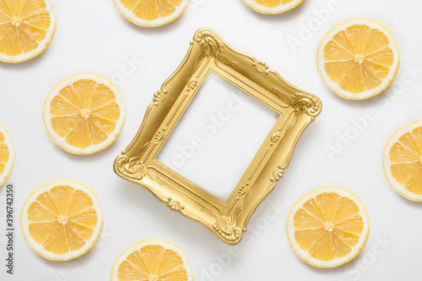 Fototapeta The frame with copy space is decorated with lemons. The concept of creative backgrounds