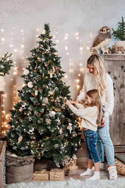 Obraz Family decorating beautiful Christmas tree in room