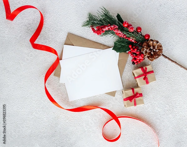 Fototapeta Blank greeting card with spruce branch on white background. Christmas and New Year composition.
