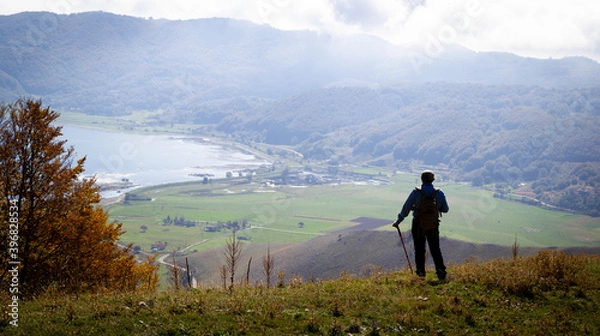 Fototapeta hiker in the mountains with lake in matese park