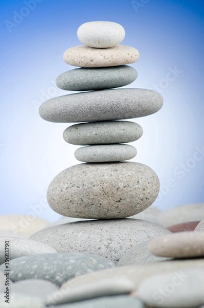 Fototapeta Pebbles stack against gradient background