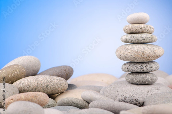 Fototapeta Pebbles stack against gradient background