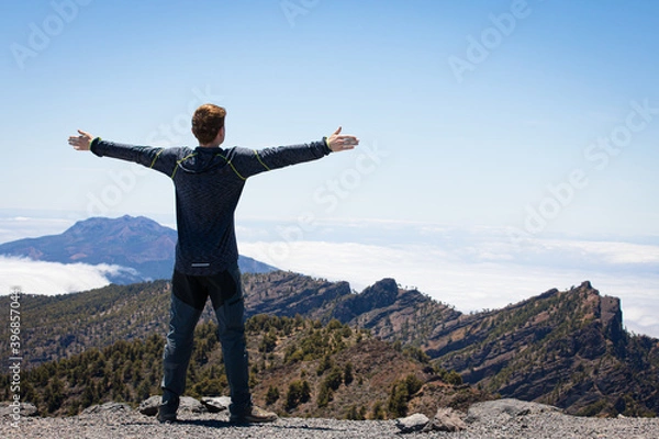 Obraz happy man above the clouds travelling on Canary Island La Palma