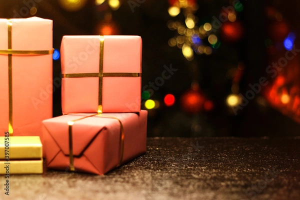 Obraz Gift boxes on new year's background with bokeh.