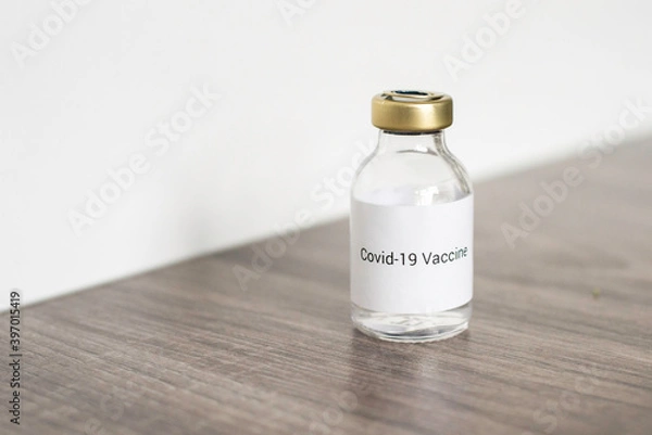 Fototapeta a vial with a medicine for the coronavirus, a vaccine for covid-19 with a syringe and needle