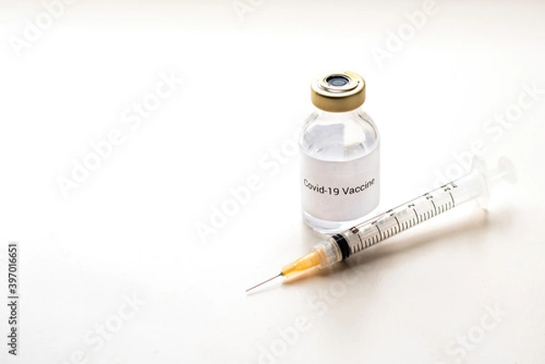 Fototapeta a vial with a medicine for the coronavirus, a vaccine for covid-19 with a syringe and needle