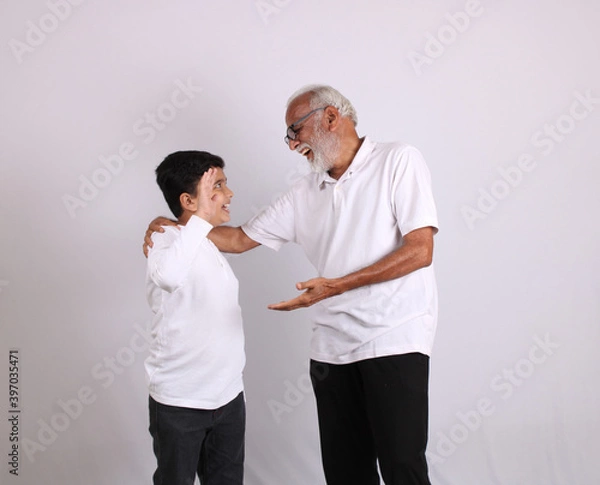 Obraz Happy Indian grandfather and grandson spending quality time