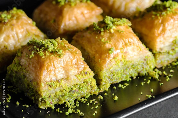 Fototapeta Traditional turkish dessert antep baklava with pistachio on rustic table,  ramadan or holiday desserts concept
