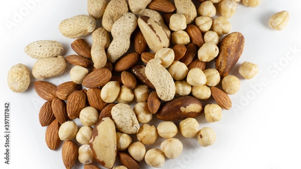 Fototapeta A handful of nuts on a white background