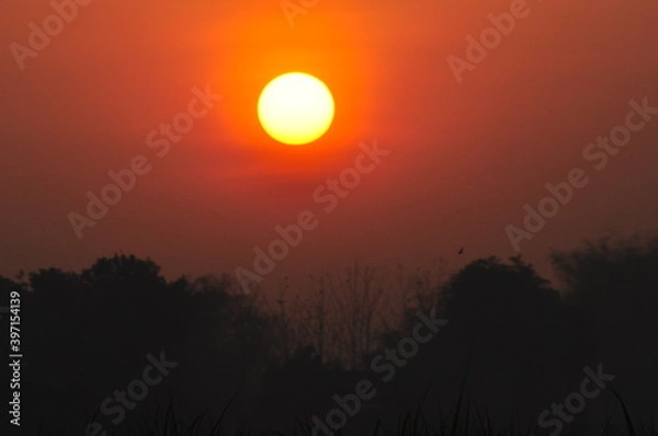Fototapeta sunset over the mountains