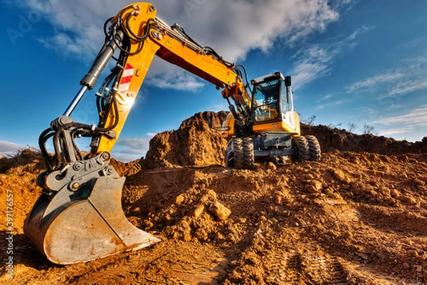 Fototapeta Bagger im Sand