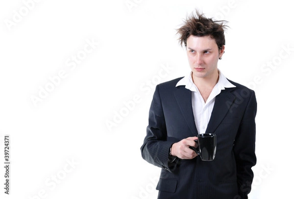 Obraz Tired businessman holding cup of coffee